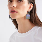 Elk Brikka Cobalt earrings featuring sleek, modern design with cobalt blue accents and silver hooks, displayed on a white background.