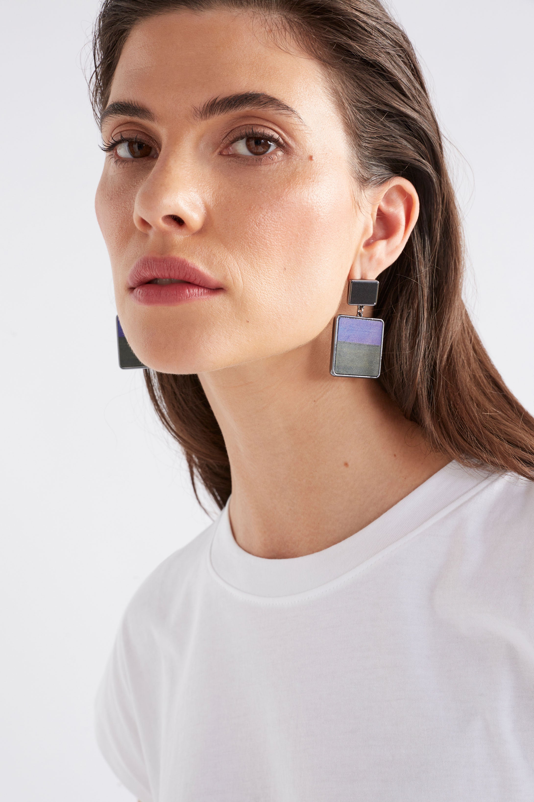 Elk Brikka Cobalt earrings featuring sleek, modern design with cobalt blue accents and silver hooks, displayed on a white background.