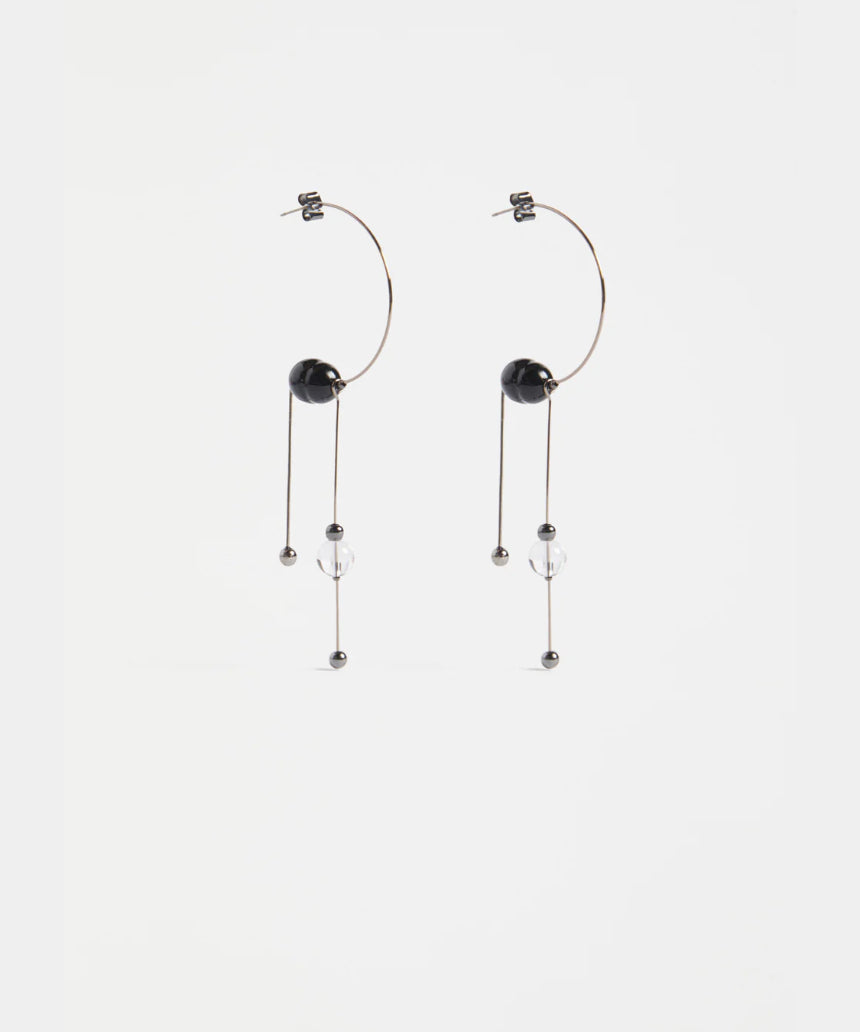 Elk Pykka Drop Earring in gunmetal with sleek, modern design and teardrop shape, hanging elegantly from the ear.