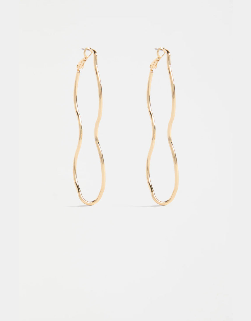 Gold Elk Svel long hoop earrings with sleek, minimalist design, featuring thin, elongated hoops for a modern jewelry look.