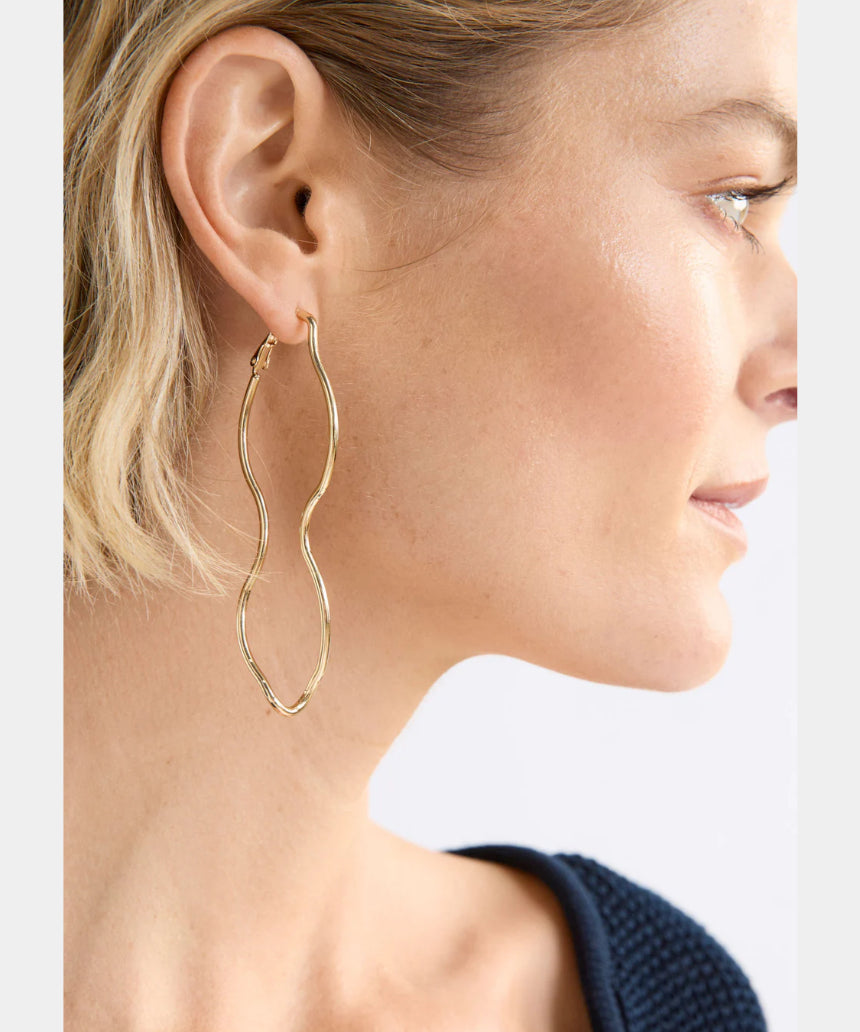 Gold Elk Svel Long Hoop Earrings with sleek, minimalist design, showcasing elongated hoop style and shiny finish.