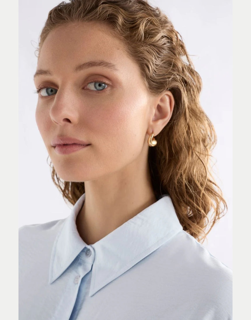 Gold Elk Aisem Mini Hoop Earring with a sleek, minimalist design, shown close-up on a white background.