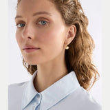 Gold Elk Aisem Mini Hoop Earring with a sleek, minimalist design, shown close-up on a white background.
