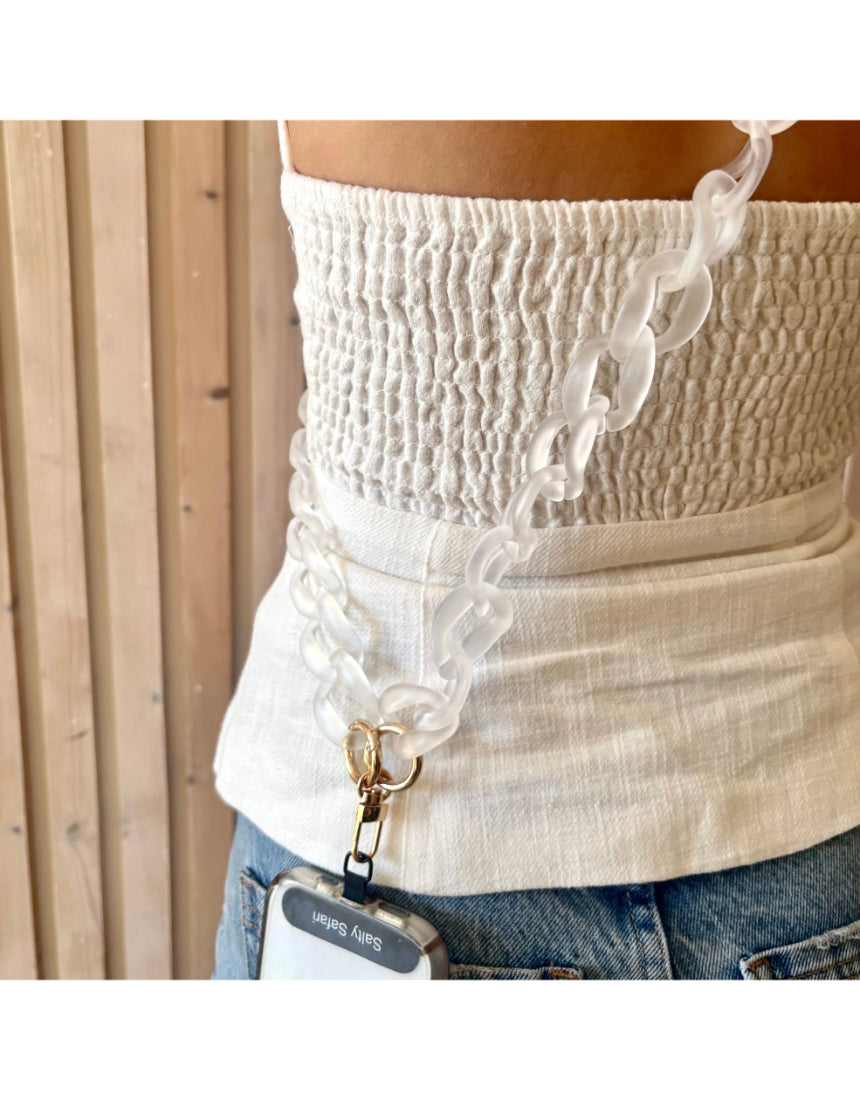 Clear Capri phone strap accessory by Salty Safari featuring a sleek, transparent design for secure phone handling.