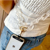 Salty Safari Capri phone strap accessory in clear, with a colorful design, attached to a phone for secure, stylish handling.