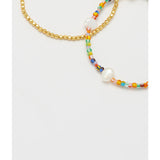 Estella Bartlett rainbow pearl bracelet set featuring colorful pearl strands and delicate silver accents on a white background.
