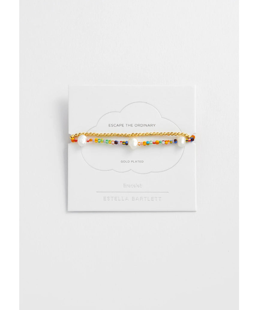 Estella Bartlett rainbow pearl bracelet set featuring colorful pearl bracelets with silver accents on a white background.