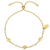 Estella Bartlett flower pearl hammered disc bracelet with delicate chain and floral charm on a jewelry display.