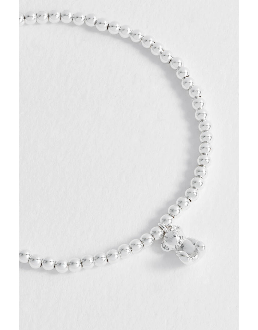 Estella Bartlett beaded teddy bear charm bracelet with colorful beads and silver accents, stylish jewelry accessory.