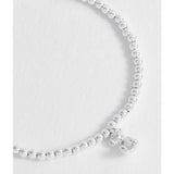 Estella Bartlett beaded teddy bear charm bracelet with colorful beads and silver accents, stylish jewelry accessory.