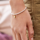 Estella Bartlett puffed star Sienna bracelet with gold-tone chain and star charm, stylish jewelry accessory.