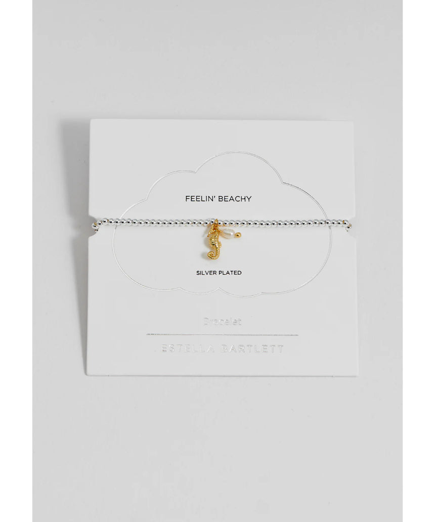 Estella Bartlett Seahorse and Pearl Sienna bracelet featuring a seahorse charm and white pearls on a delicate chain.