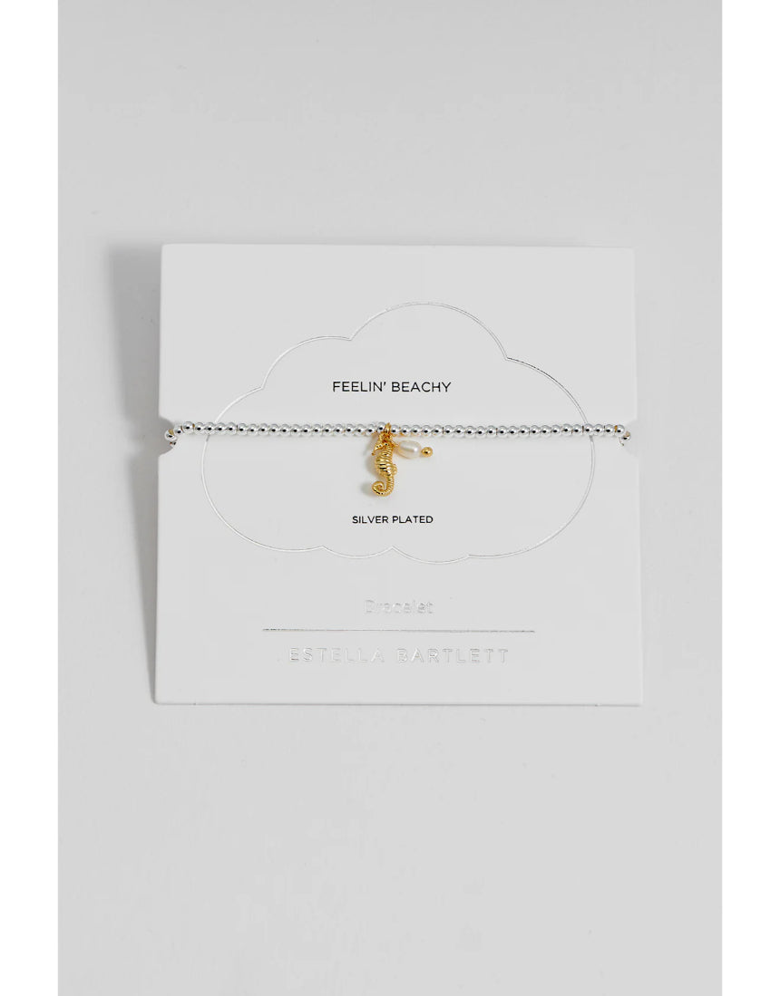 Estella Bartlett Seahorse and Pearl Sienna bracelet featuring a seahorse charm and white pearls on a delicate chain.