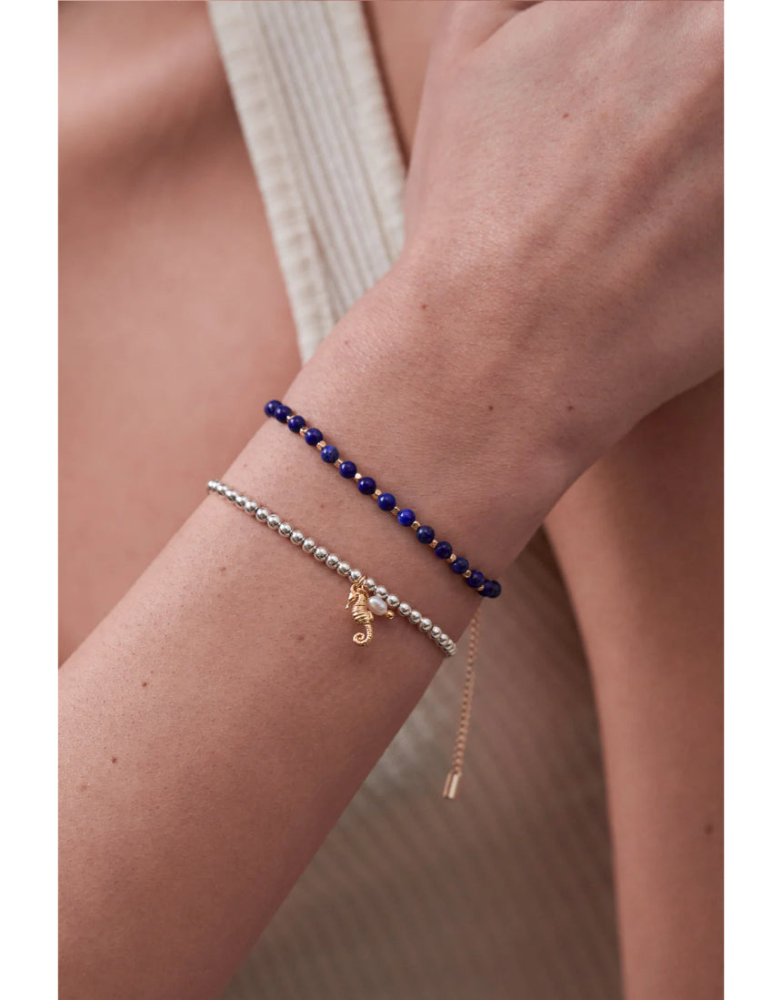 Estella Bartlett seahorse and pearl Sienna bracelet featuring a delicate charm and elegant design on a fine chain.
