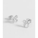 Silver Estella Bartlett pearl bow stud earrings with delicate design and shiny finish, featuring elegant pearl accents.