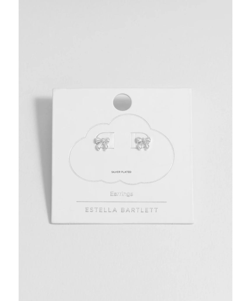 Silver pearl bow stud earrings by Estella Bartlett featuring elegant pearl accents and delicate bow design.