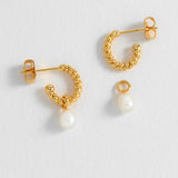 Estella Bartlett pearl drop and twist hoop earrings featuring elegant pearl accents and gold-tone hoop design.