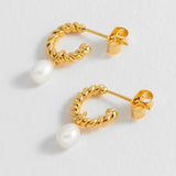 Estella Bartlett pearl drop and twist hoop earrings with elegant design and shiny metal finish.