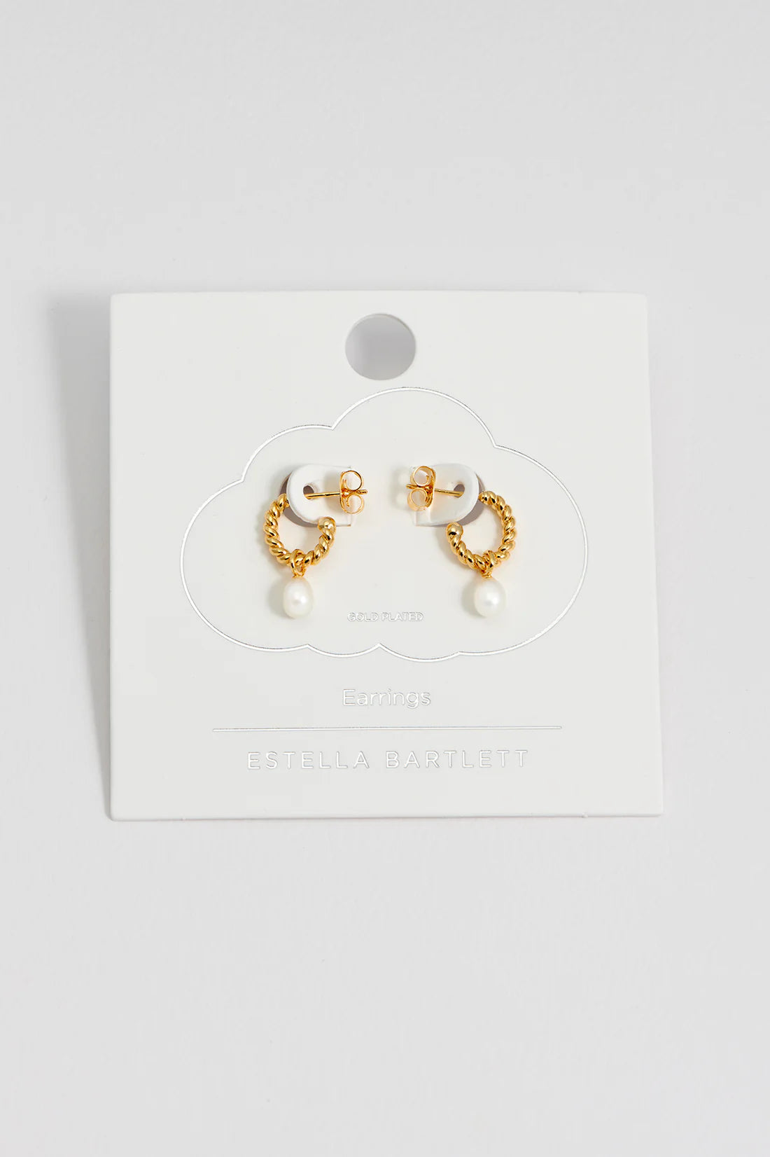 Estella Bartlett pearl drop and twist hoop earrings with elegant design, featuring pearl accents and silver-tone hoops.