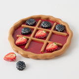 Decorative game of Strawberry & Blackberry Tart Noughts and Crosses by Pilbeam Living, featuring colorful fruit-themed game pieces.