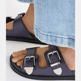 Navy Elk Spenne sandal shoes with open toe design and ankle strap, casual footwear for warm weather.