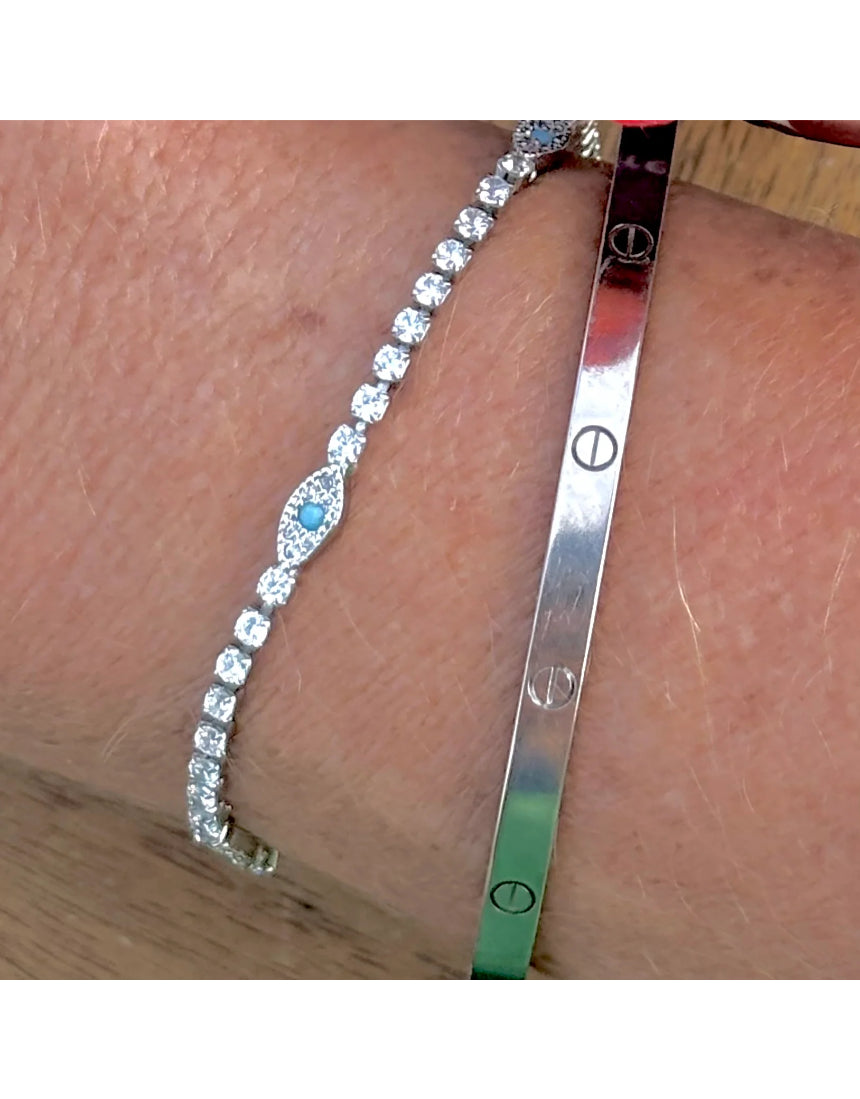 Salty Safari Evil Eye Protection Tennis Bracelet featuring a silver chain with colorful evil eye charms on a white background.