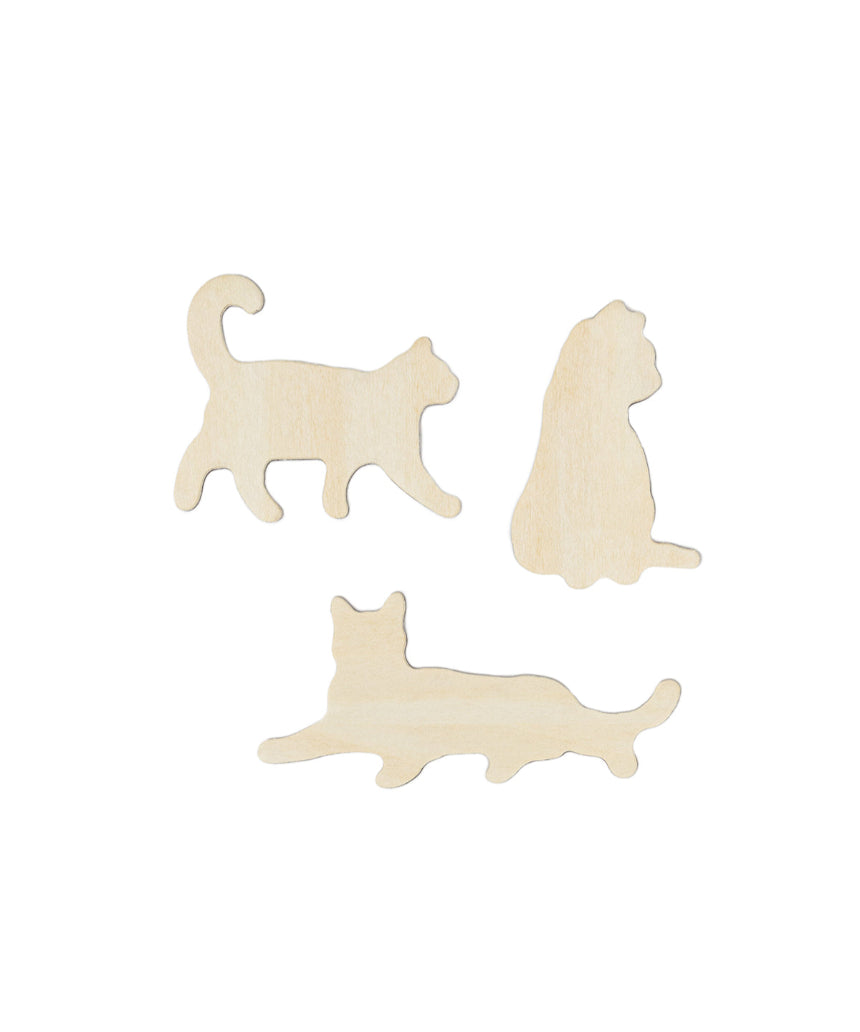 Set of Suck UK fridge magnets featuring colorful, playful cat designs, perfect for decorating and organizing your kitchen.
