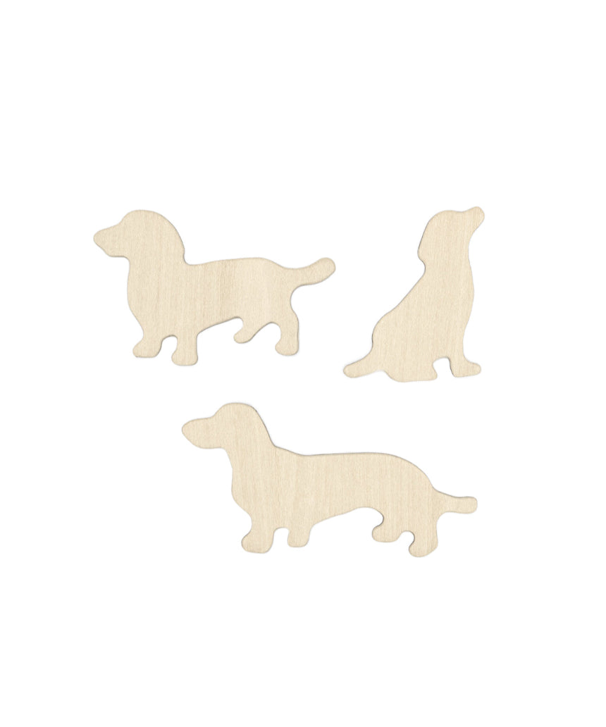 Set of Suck UK fridge magnets featuring colorful dog-shaped designs on a white background.