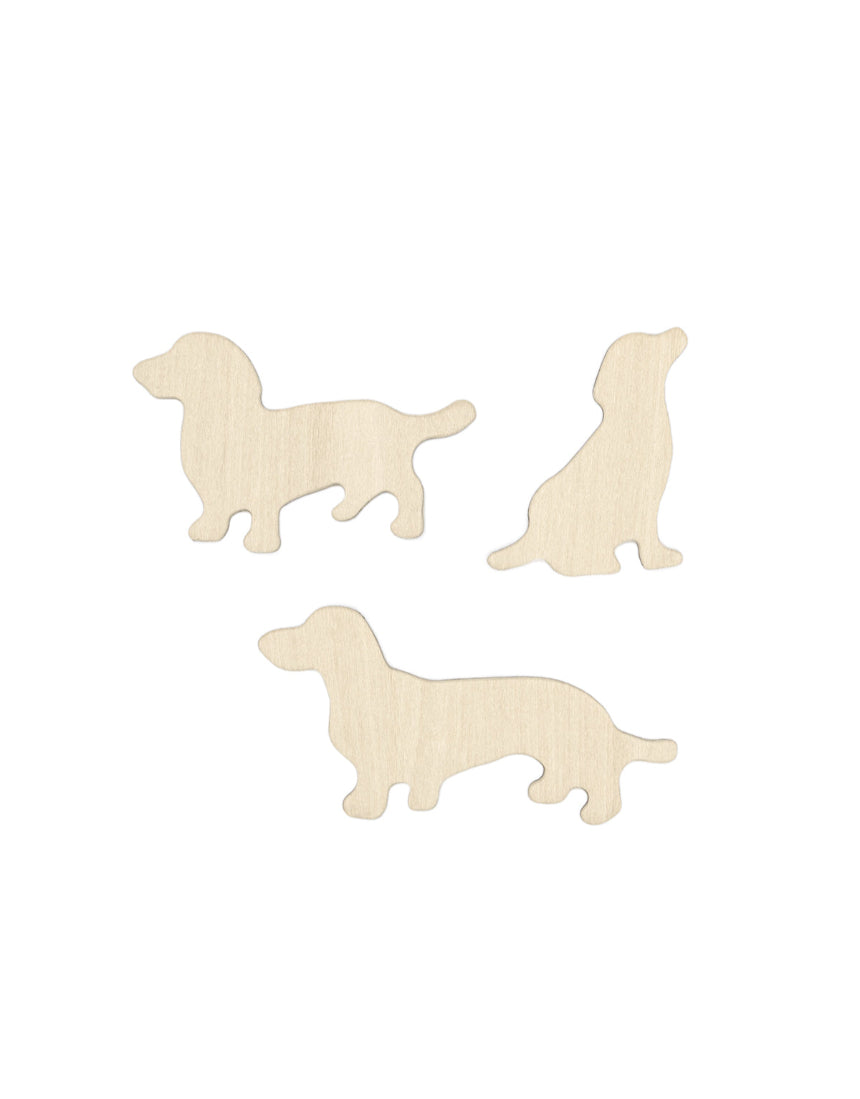 Set of Suck UK fridge magnets featuring colorful dog-shaped designs on a white background.