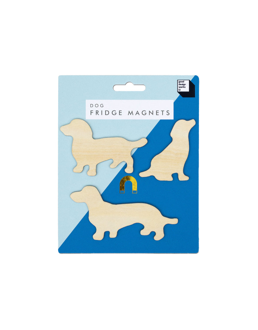 Set of Suck UK fridge magnets featuring playful dog designs on a metallic surface.