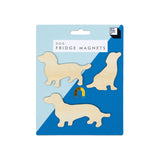 Set of Suck UK fridge magnets featuring playful dog designs on a metallic surface.