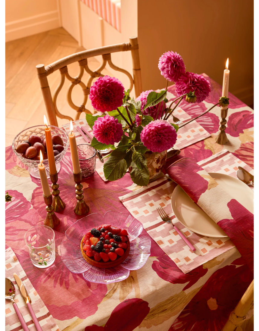 Bonnie and Neil Gem Smoke glass tumbler with a sleek, modern design, shown on a dining table in a stylish dining room setting.