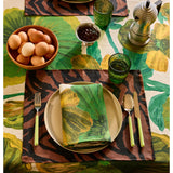 Bonnie and Neil Gem Green glass tumbler with a smooth, rounded shape, displayed on a dining table setting.