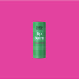 Green peppermint lip balm by Bloom & Body in a sleek container with fresh mint leaves beside it.