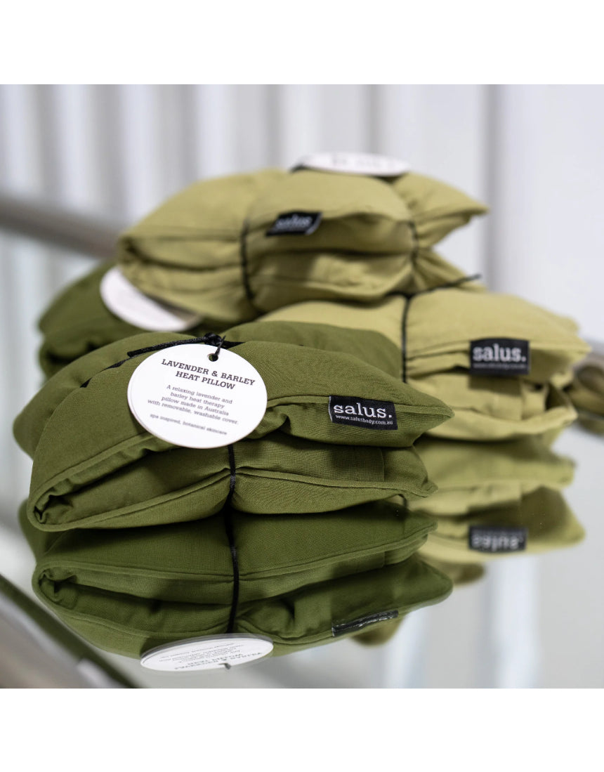 Salus Lavender & Barley heat pillow in forest green square shape, designed for soothing bath and body relaxation.