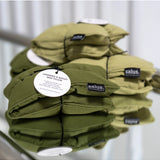 Salus Lavender & Barley heat pillow in forest green square shape, designed for soothing bath and body relaxation.