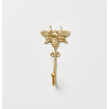 Brass bees wall hook by Bonnie and Neil with detailed bee design, mounted on a wall for decorative organization.
