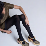 Black Herringbone Merino Wool Tights by Tightology, close-up of the textured pattern and snug fit on the legs.
