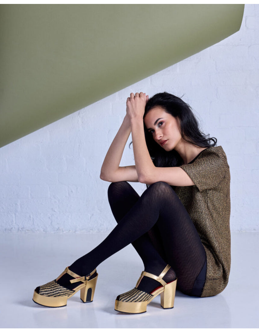 Black Herringbone Merino Wool Tights by Tightology, showcasing textured pattern and fitted design for stylish warmth.