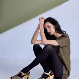 Black Herringbone Merino Wool Tights by Tightology, showcasing textured pattern and fitted design for stylish warmth.