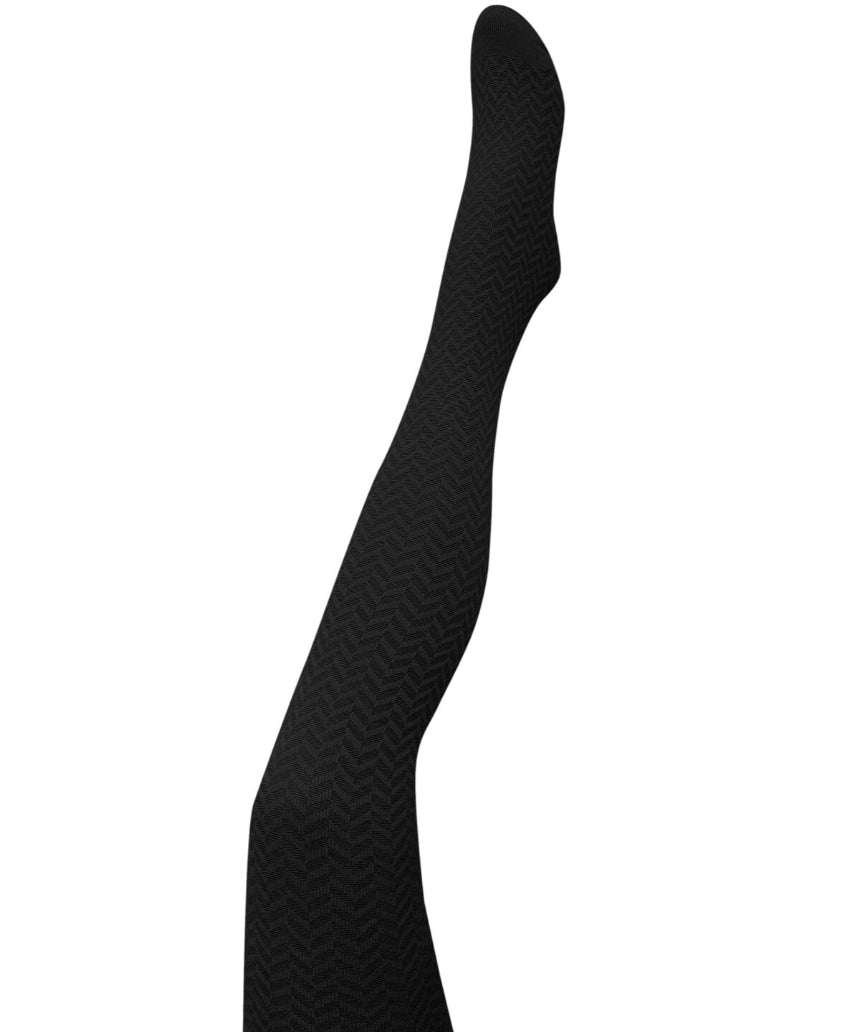 Black herringbone merino wool tights by Tightology, close-up of textured pattern and fitted design on model's legs.
