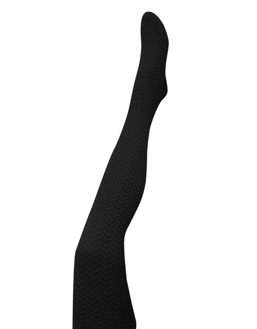 Black herringbone merino wool tights by Tightology, close-up of textured pattern and fitted design on model's legs.