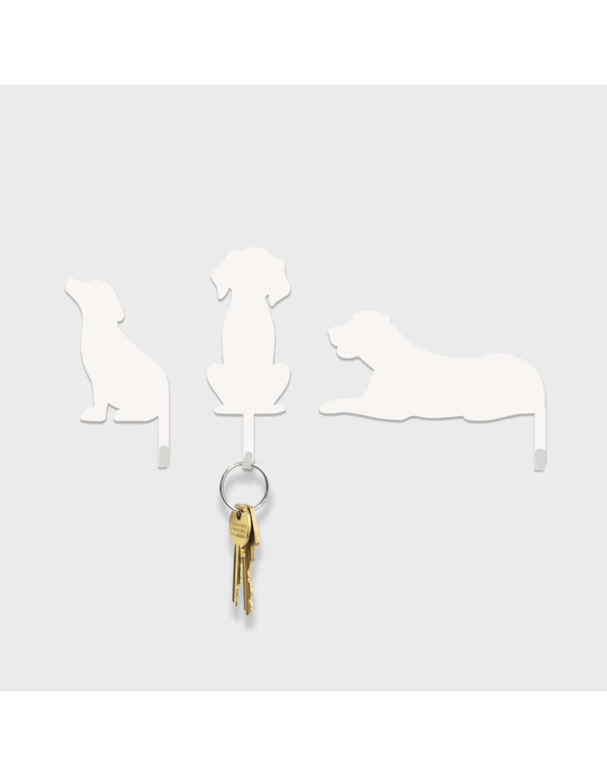 Suck UK Hooks Dog wall hook shaped like a playful dog figure, made of metal, used for hanging coats or accessories.