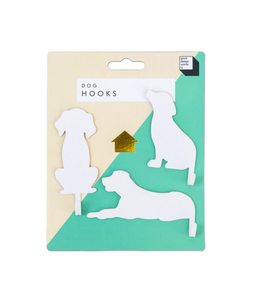 Suck UK Hooks Dog decorative wall hook shaped like a dog for hanging keys or accessories on a modern home wall.
