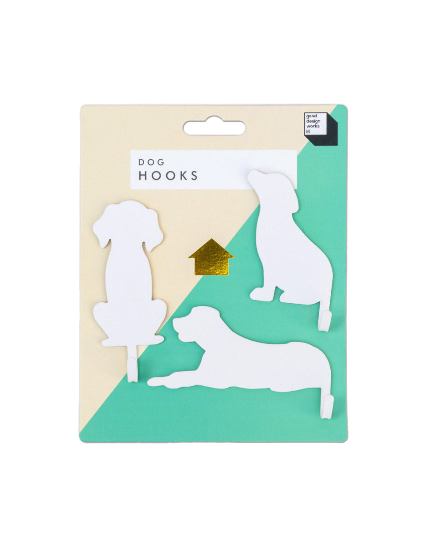Suck UK Hooks Dog decorative wall hook shaped like a dog for hanging keys or accessories on a modern home wall.