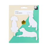 Suck UK Hooks Dog decorative wall hook shaped like a dog for hanging keys or accessories on a modern home wall.
