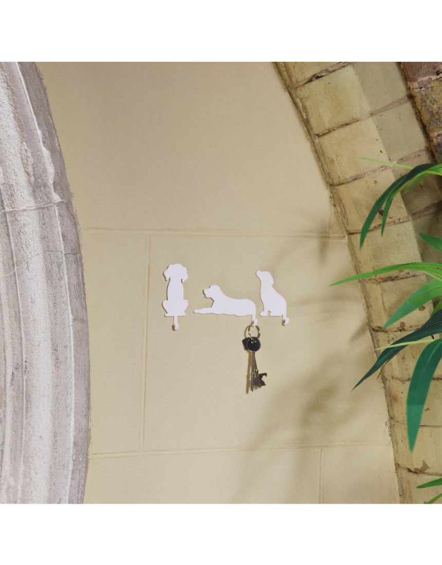 Suck UK Hooks Dog wall hook shaped like a playful dog, made of metal with a hook for hanging items.