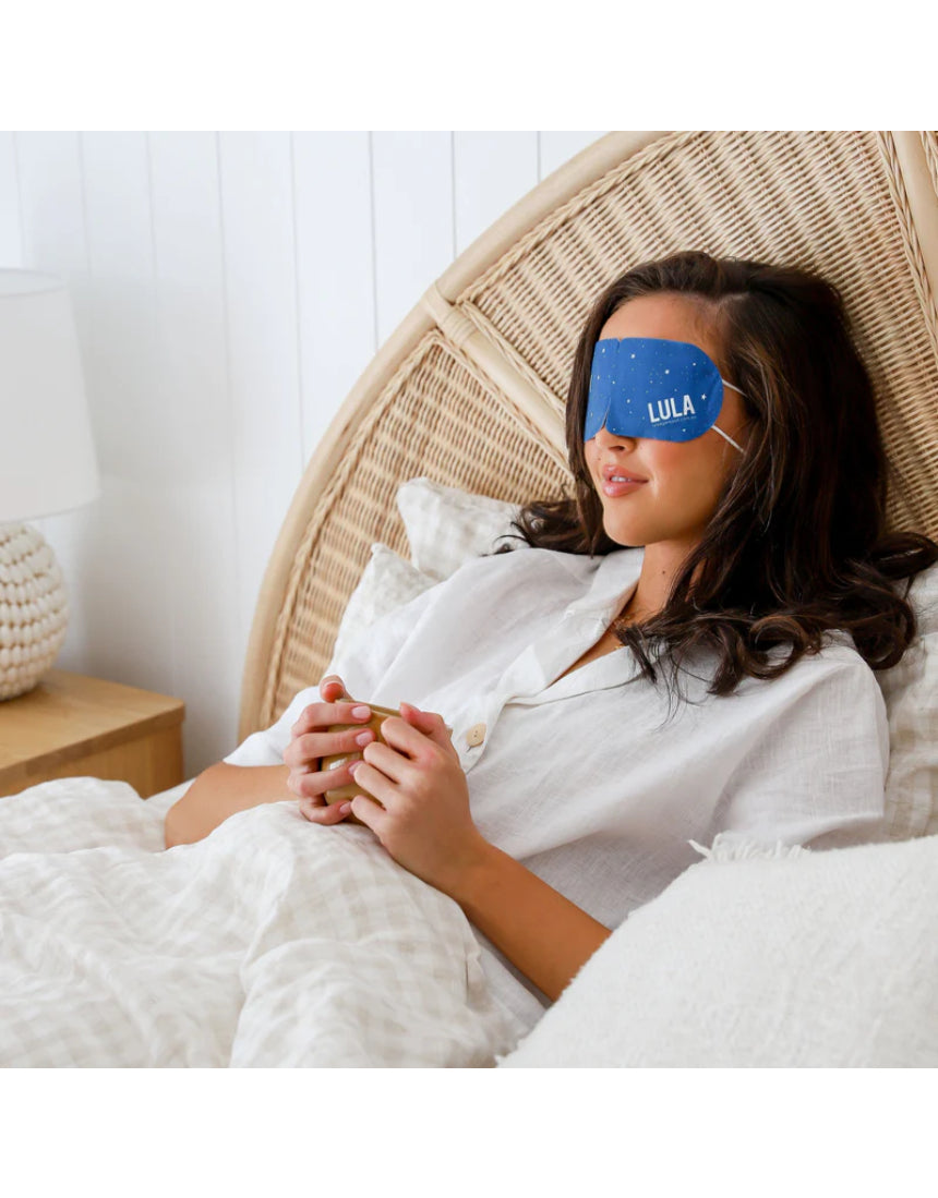 Lula self-warming eye mask in lavender color, shown with five masks stacked, designed for soothing relaxation and eye comfort.