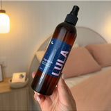 Lula Magnesium Spay eye mask, soft fabric with attached magnesium spray, designed for soothing eye area and relaxation.
