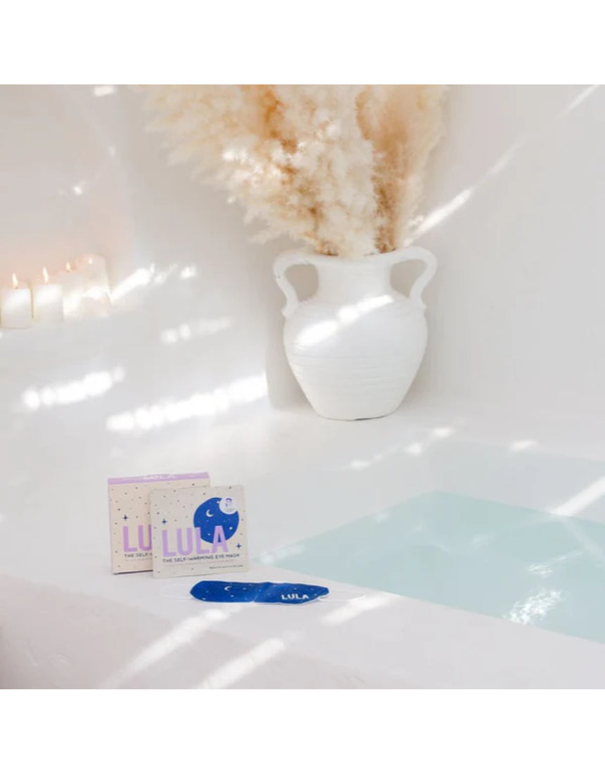 Lula self-warming lavender eye mask with soft fabric, designed for relaxation and eye comfort, shown in the image.